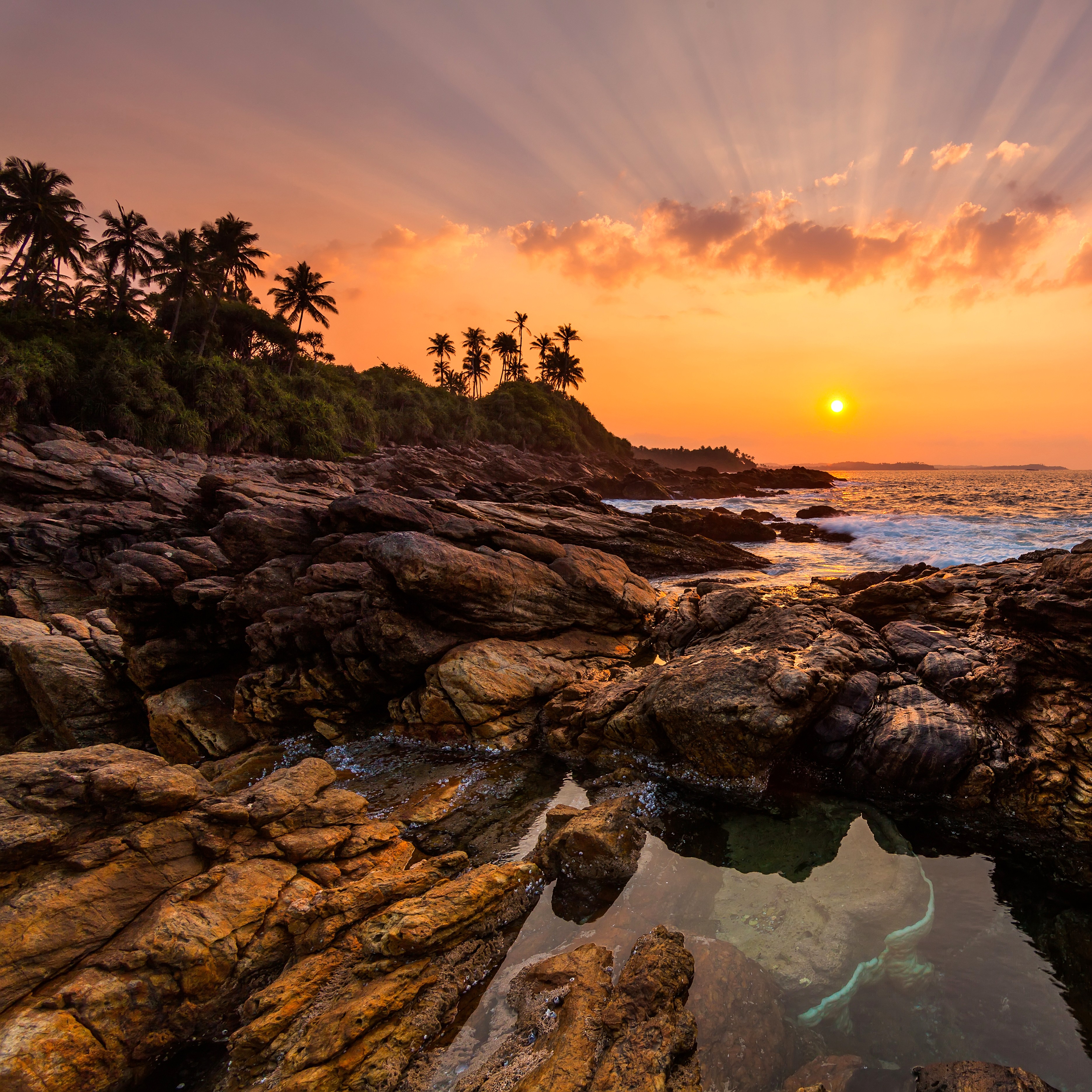 /images/destination/tropical-sunset-over-rocky-coastline-with-palm-tre-2026-03-16-02-37-12-utc.jpg